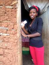 Alice Outside Her Home in a Ugandan Slum