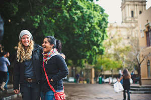 Scholar Myomena and staff Elizabeth on campus