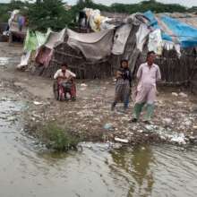 Child with disability at his flood stricken home