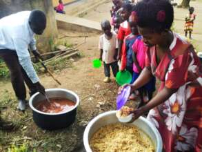 Serving the children lunch.