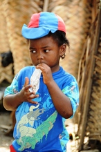 Young boy eating Supplementary'Plumpy®