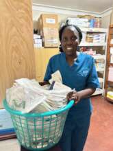 Esther with donations from Holland.