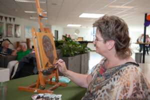 Marianne painting during the celebrations.
