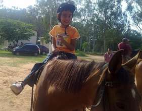 Reuel on horseback; equestrian therapy