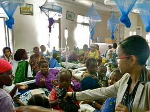 Handing out food to the children of Ward III
