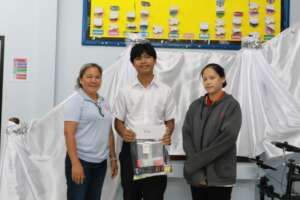A special needs boy is learning to read and write