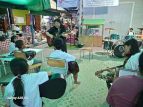 Students having free music lessons after school