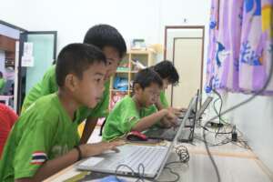 Children learning with computers at Hand to Hand