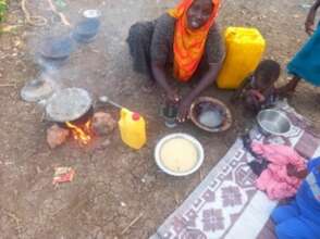 Impact Story 5: Nuney cooking food for her childre