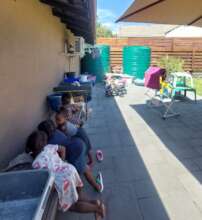 The children playing in the shade on a hot day
