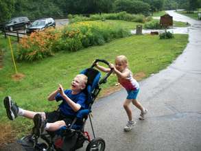Kaylie Pushing Kyle in his Stroller