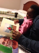 Showing Princess some of our Haiti pictures