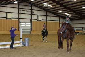 Riders in the indoor arena