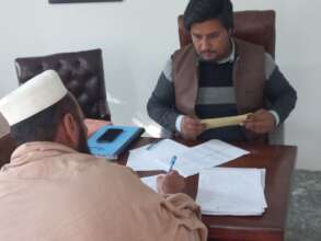 Male parents in discussion at PTM