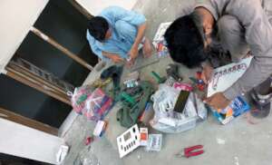 electrician busy in repair of the electric boards