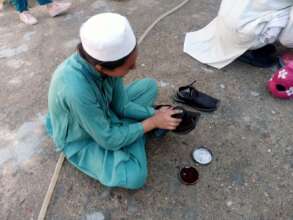 a student representing the role of cobbler