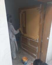 paint coat being given to doors of the college
