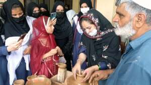 a student experiencing pottery