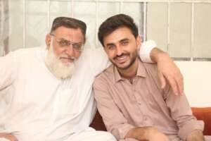 Abid with his father post corneal transplant