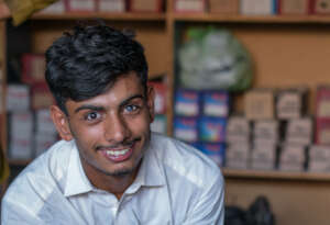 Sikandar at the shoe store where he works