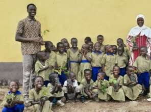 Kindergarten class with tree seedlings Oct. 2025