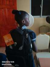 Student receiving school supplies