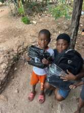 Mother and her child receiving school supplies.