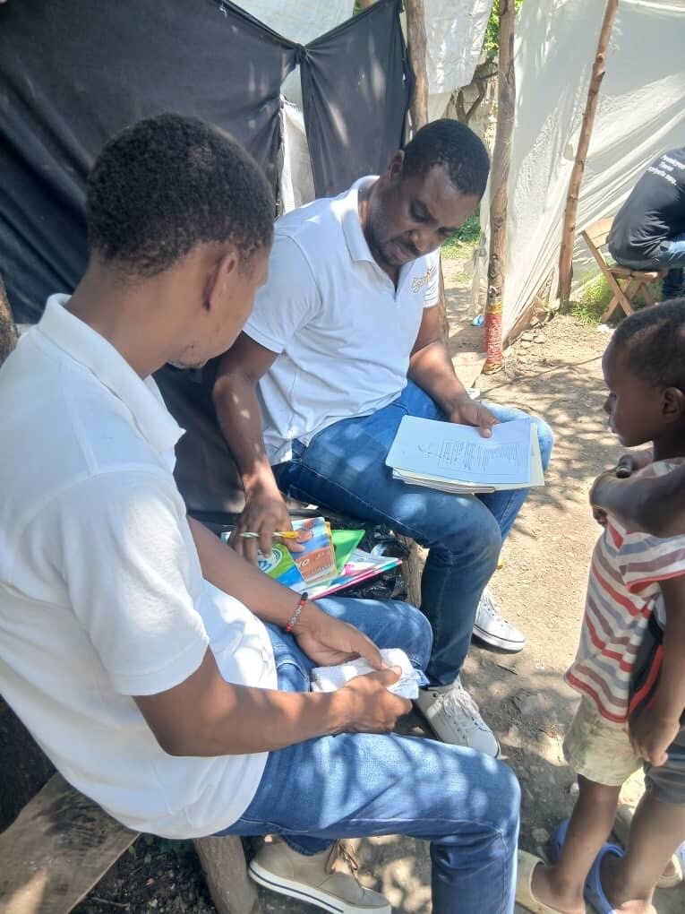 LFBS team providing school books to family