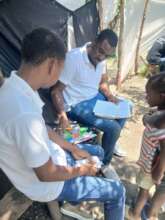 LFBS team providing school books to family