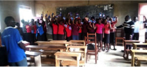 Girls at a partner school receiving their kits!