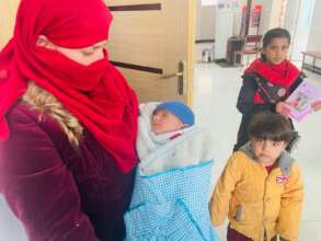 Benafsha and her children at the Health Facility