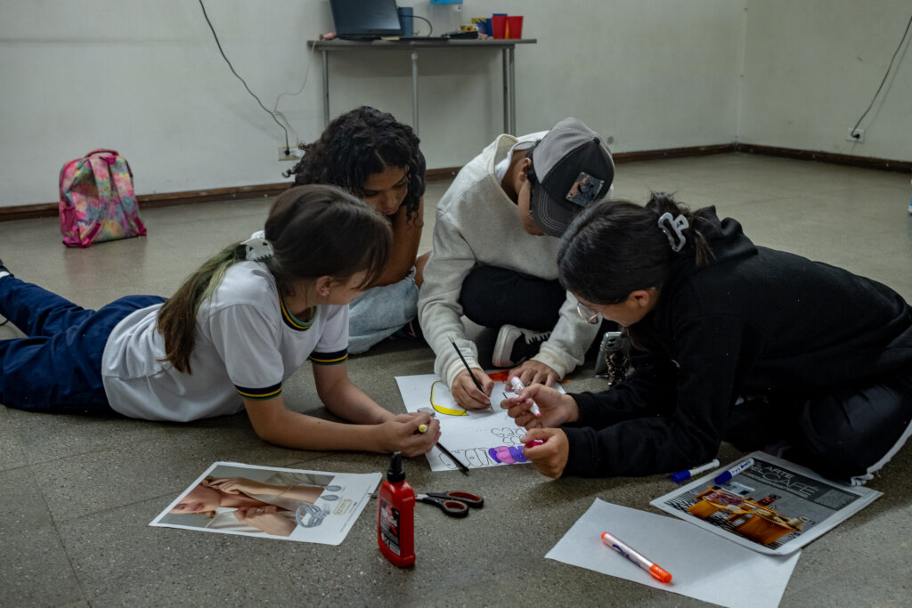 Participants working on graphic designs