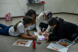 Participants working on graphic designs