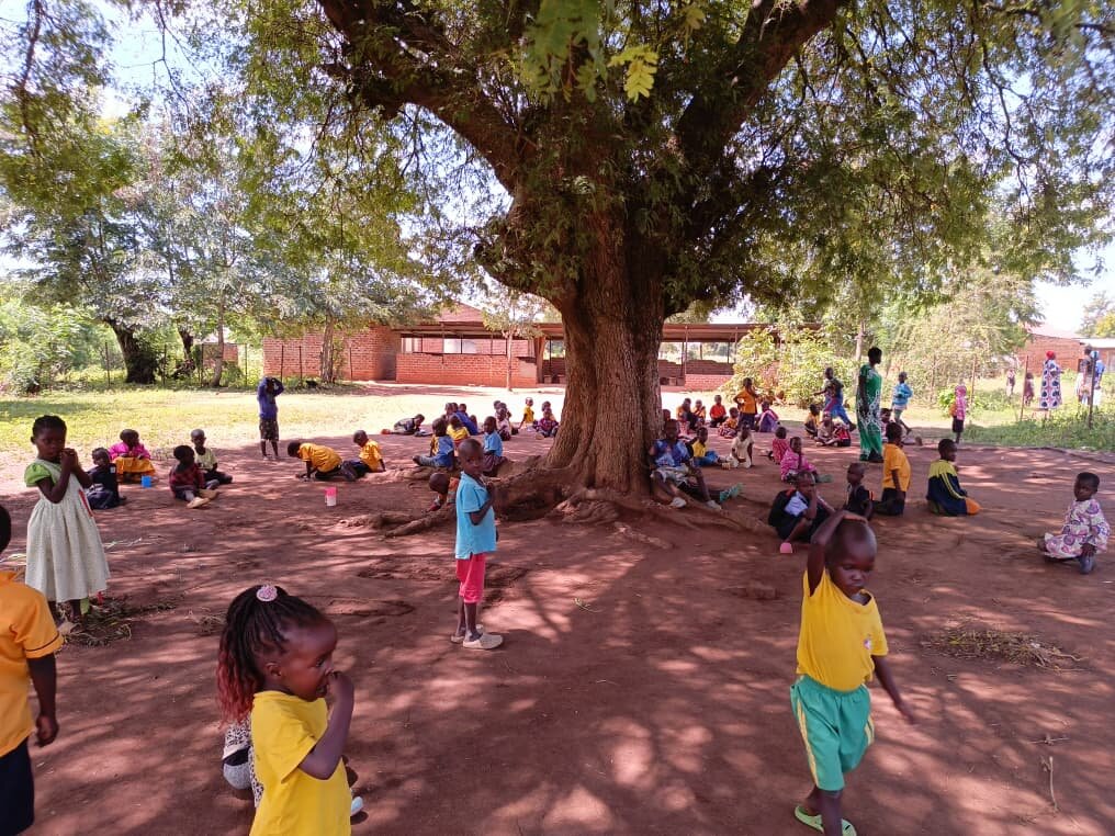 Early years class under the village tree in Agaria