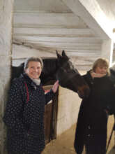 Emike, a 92 old lady with a volunteer and a horse