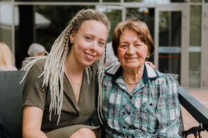 volunteer with a visiting elderly person