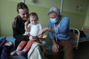 A young girl injured by a nearby explosion