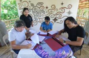 signing the turnover documents to the community