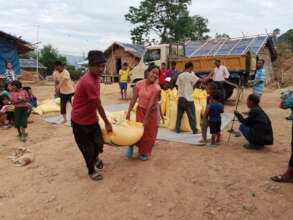 Refugees purchasing food items from the Food Bank