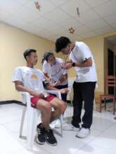 Paolo demonstrating how to take blood pressure
