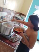 Serving a meal in the shared kitchen