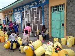 Community members queuing to fetch water