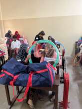 Teachers receiving sports equipment bags