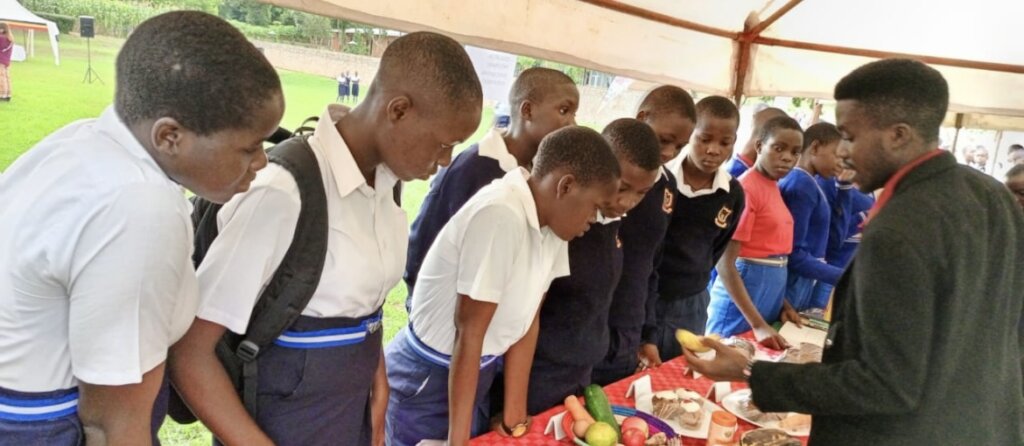 Students paying attention to a local vendor