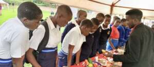 Students paying attention to a local vendor