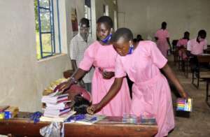 Students getting exercise books