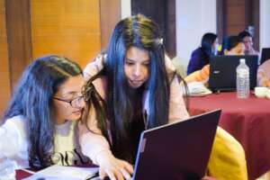 Mentor helping fellows to solve a problem