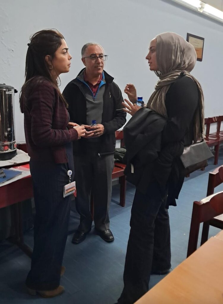 Nisreen (R) with a doctor (M) EJHN staffer (L)