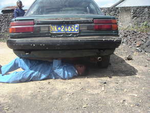 Kakule repairs a car at Virunga center