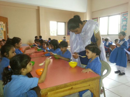Students enjoying wheat porridge